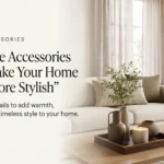 Stylish home accessories including ceramic vases, decorative tray, candle and cushions